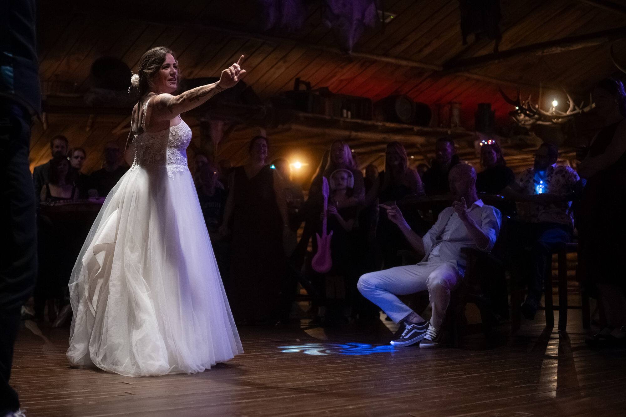 Bride dancing in front of the wedding guests